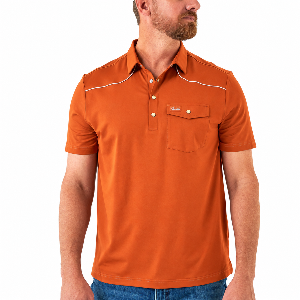 A man wearing a short-sleeve orange polo shirt with white contrast stitching, a two-button placket, and a chest pocket with a small logo tab, photographed against a plain white background.