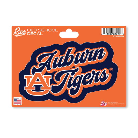 Die-cut Auburn Tigers decal. The card is bright orange with a hanging hole at the top, a barcode in the upper right, and small printed text including 'Rice Decals' and 'Old School Decal.