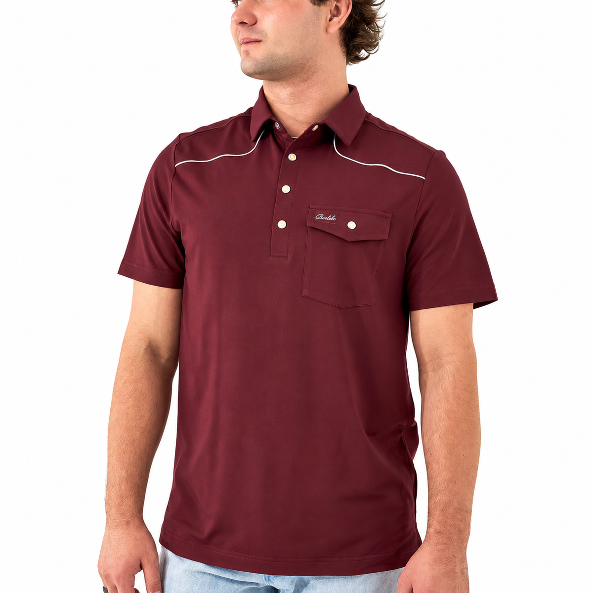 A man wearing a short-sleeve polo shirt in burgundy with white contrast stitching and a chest pocket, shown from the waist up against a plain white background.