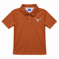 A burnt orange short-sleeve polo shirt with a three-button placket and a silver embroidered Longhorn logo on the left chest, displayed on a clean white background.