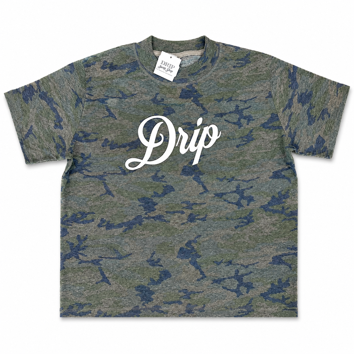 A short-sleeve crewneck t-shirt featuring a green and blue camouflage pattern with the word 'Drip' printed in white script across the chest. A white brand tag for 'Casual' is visible inside the collar.