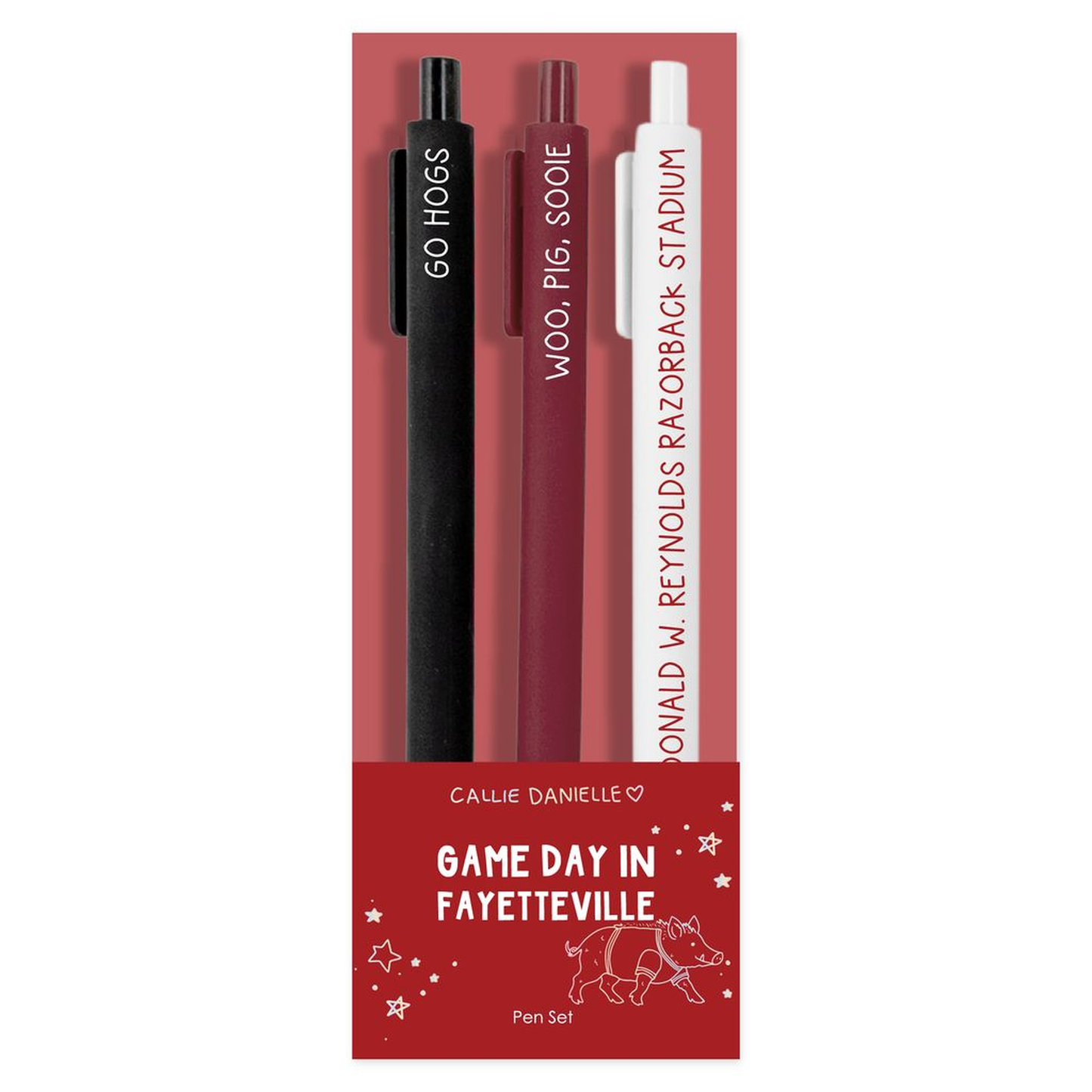 A pen set in red packaging featuring three pens: one black pen labeled 'GO HOGS,' one dark red pen labeled 'WOO, PIG, SOOIE,' and one white pen labeled 'DONALD W. REYNOLDS RAZORBACK STADIUM.