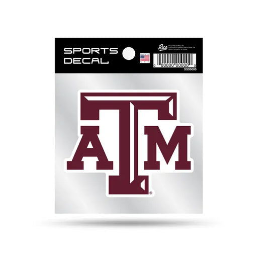 A sports decal sheet featuring the Texas A&M University 'ATM' logo in maroon and white, presented on a reflective silver backing card with a black header labeled 'SPORTS DECAL'.