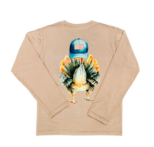 A beige long-sleeve t-shirt shown from the back, featuring a graphic of a turkey wearing a blue cap with the word 'BRUH' printed on it.