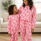 Adult and child in matching Candy Cane Wishes lounge sets