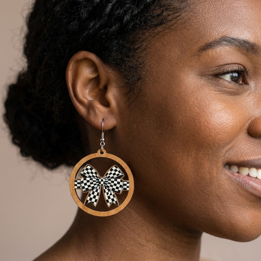 Checkered Bow Earrings on a young adult model