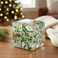 Green Christmas Qube in a cozy stocking-stuffer setting