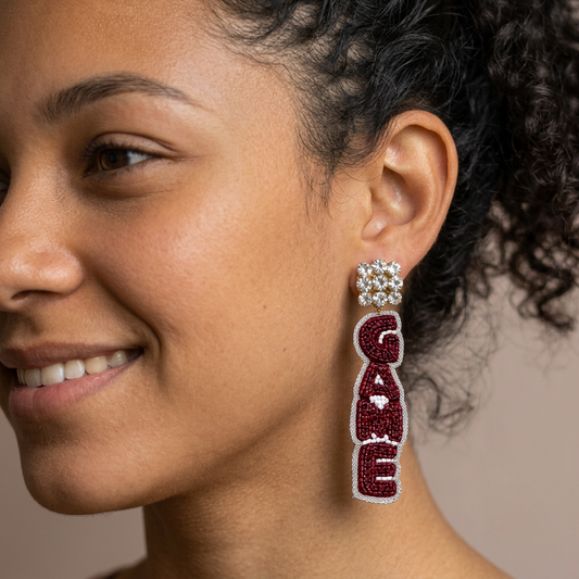 Maroon GAME beaded earring on a teen model