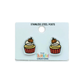 Pumpkin cupcake stud earrings displayed on a white jewelry card.
