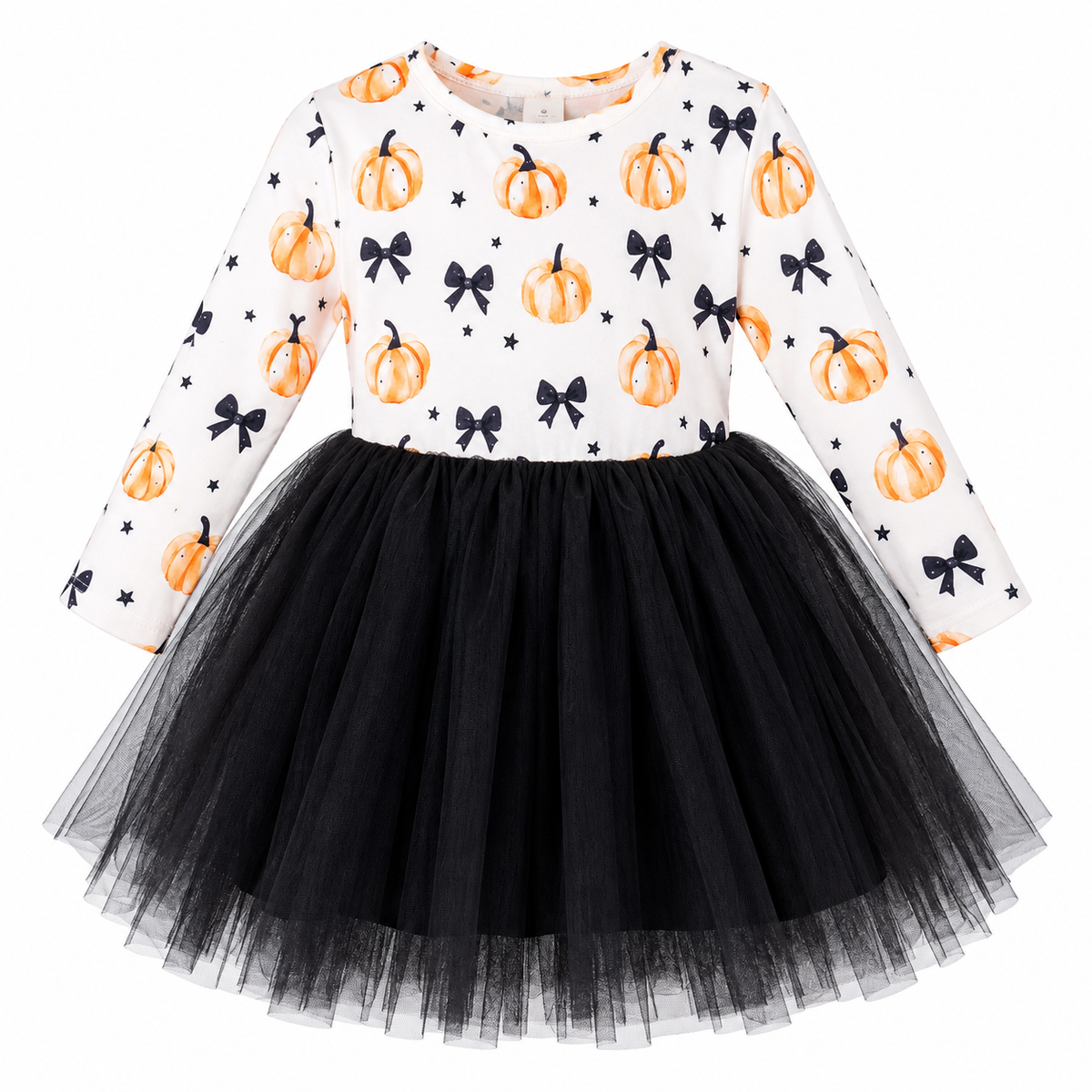 A toddler girl's long-sleeve dress with a white bodice printed with orange pumpkins, black bows, and small black stars, paired with a full black tulle tutu skirt, shown on a plain white background.
