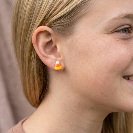 Smaller candy corn studs on a blonde teen model