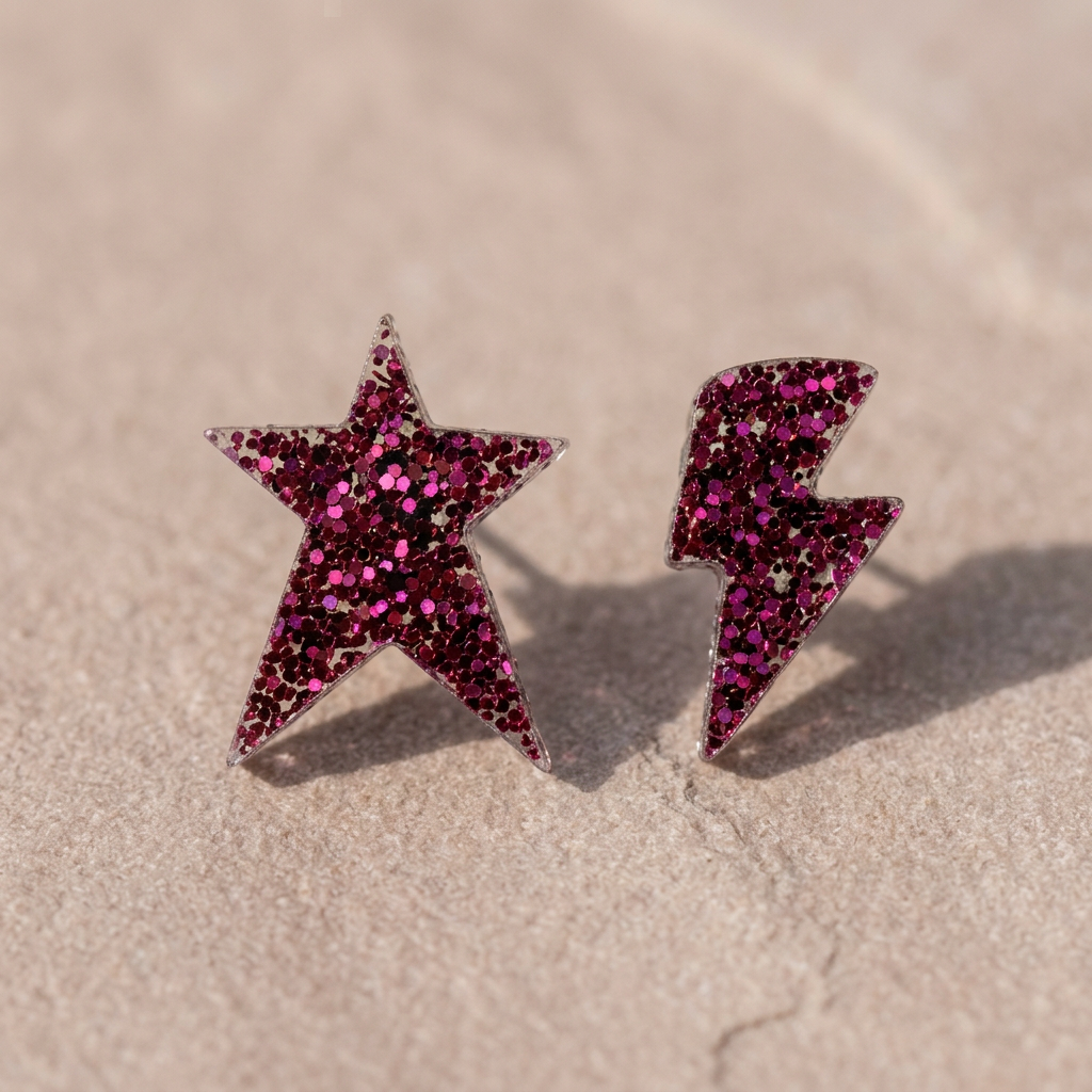 Star and lightning bolt glitter studs on matte stone